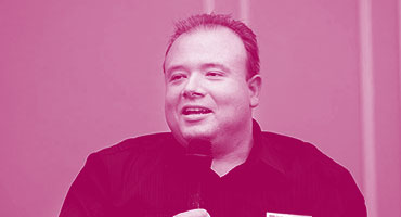 Man speaking into microphone